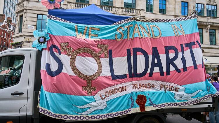 A London trans pride banner that says 'we stand in solidarity'