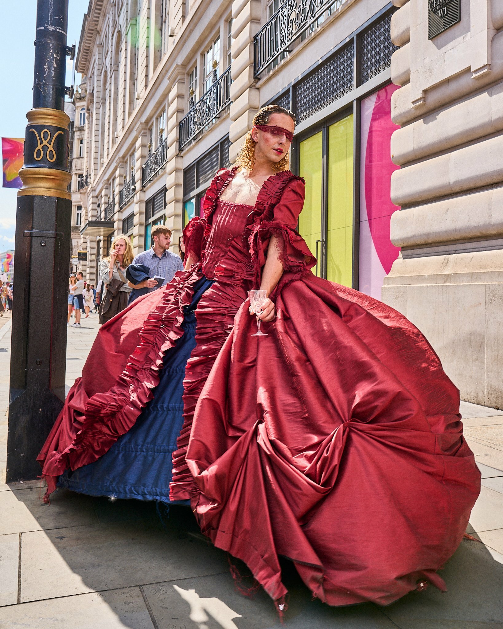 A woman wearing a voluminous red ball gown 