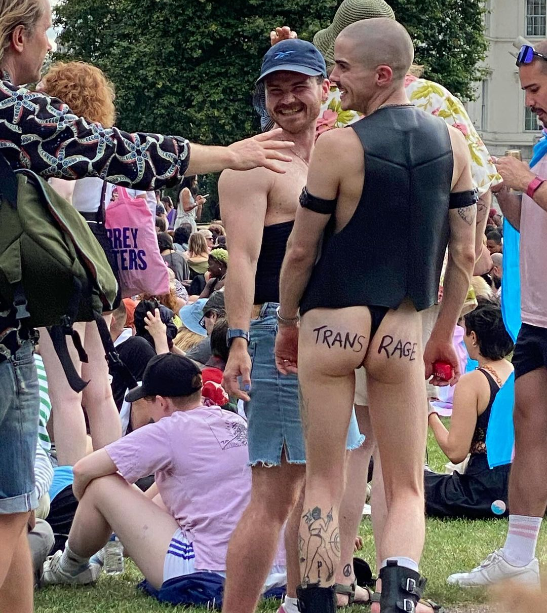 A man with 'trans rage' written on his bum cheeks 