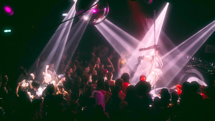 A pole performer at colour factory nightclub