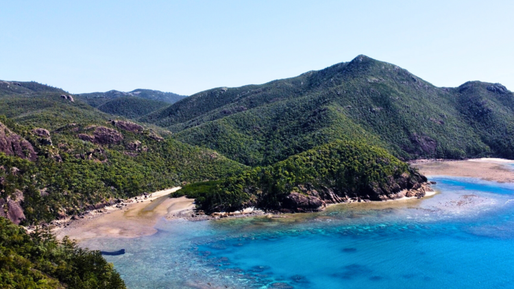 Beautiful beach surrounded by mountain forest