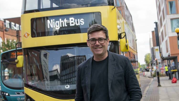 Andy Burnham in front of new Manchester night bus 