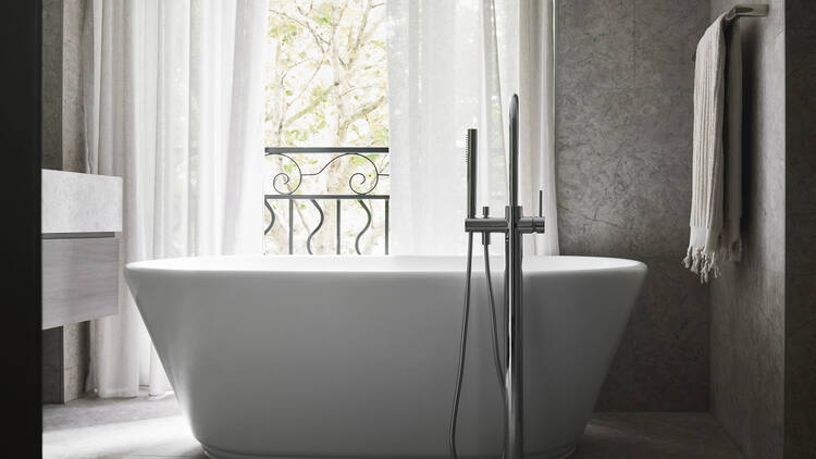 A large bath next to a balcony. 