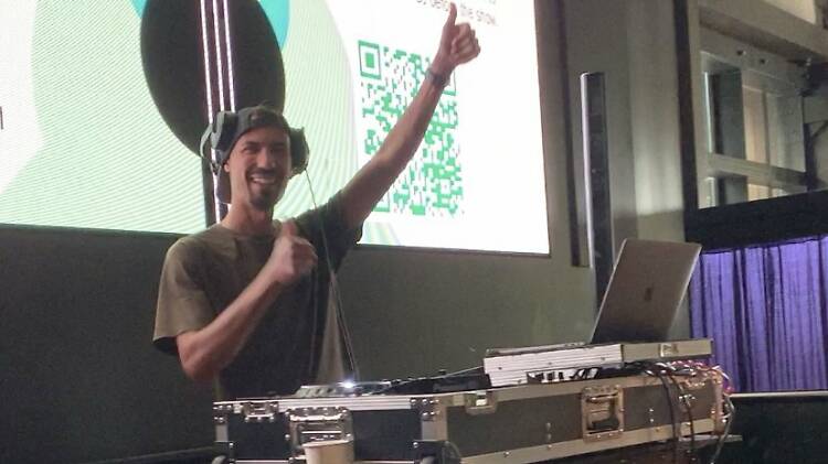 DJ Joey Lavish spins a fun playlist during a Fenway concert pregame party at Time Out Market in July