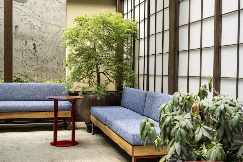 Blue couches and sliding doors on Ikigai's back patio