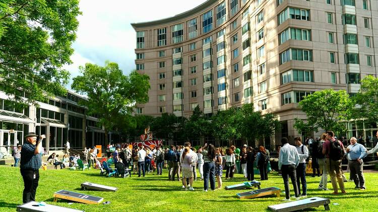 Guests play cornhole at the Tree House Brewing Co. beer garden Prudential Center