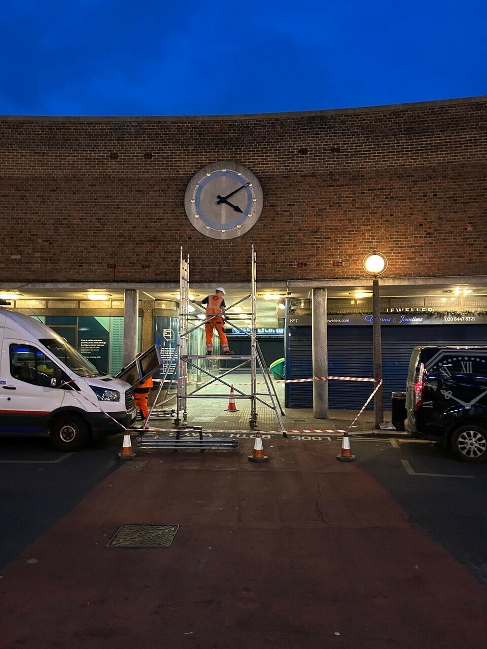 Image of clock being reinstalled