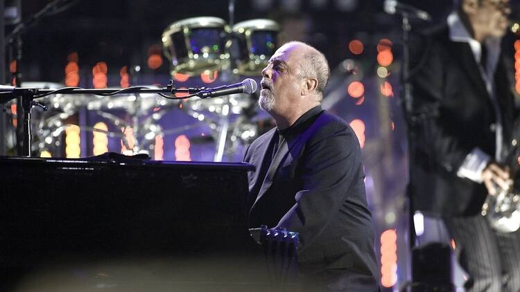 Billy Joel performing live on stage