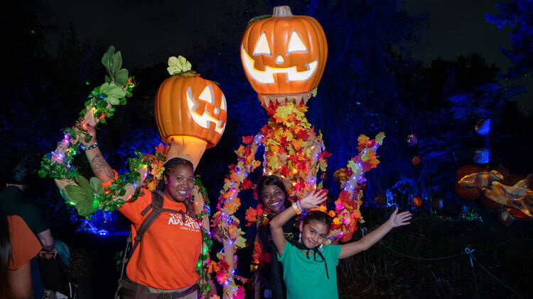People dressed up with Halloween decor.