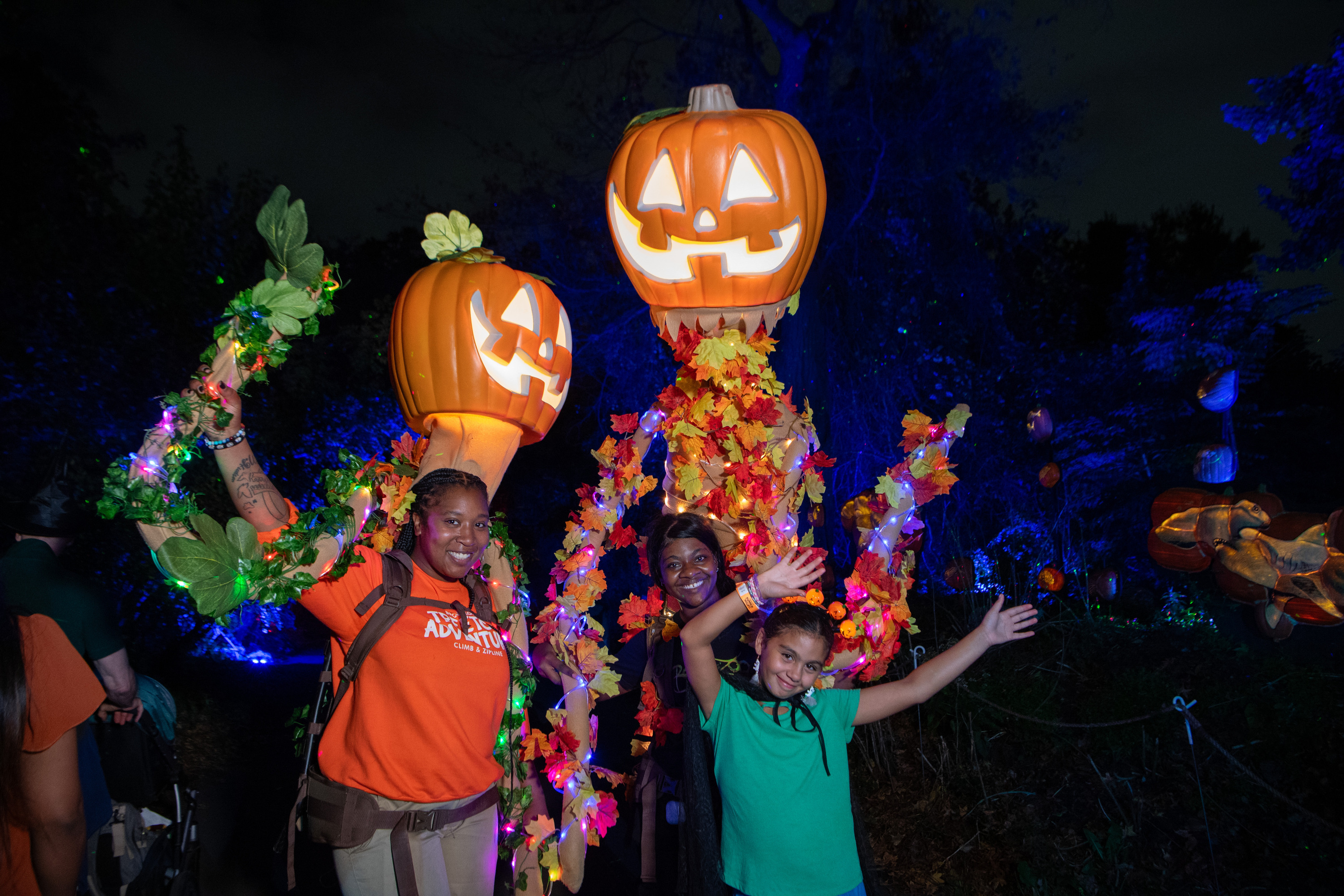 People dressed up with Halloween decor.