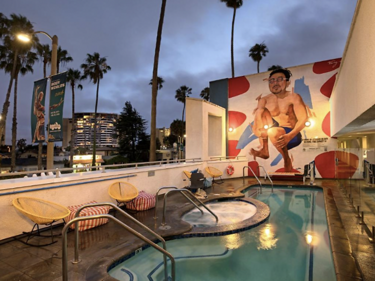 pool area with a wall mural at The Kinney, Venice Beach