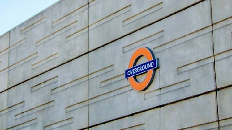 London Overground sign on the outside of a train station