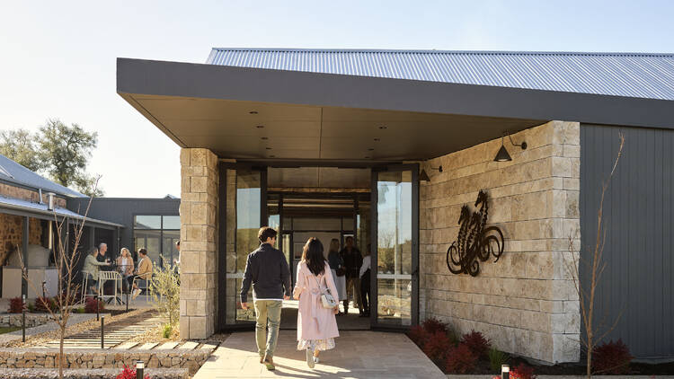 Couple walking into winery