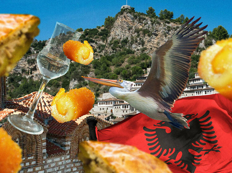 A mish-mash of Albanian things, including the Albanian flag and a glass of Raki