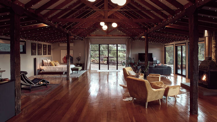 A big lovely shed accommodation with fairy lights on the ceiling.