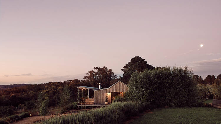 A nice looking cabin at dusk.