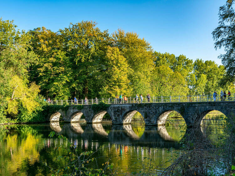 Bruges, Belgium - October 5, 2018: At the southern end of Bruges is the beautiful area known as Minnewater. The centre piece is the Lake of Love and Lovers bridge