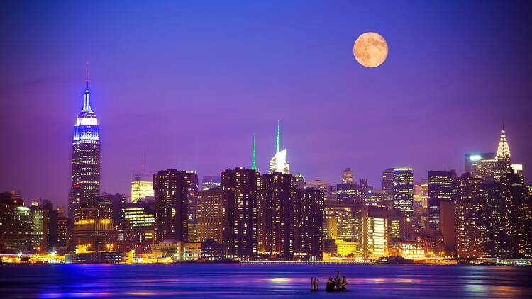 New York City at night with the moon