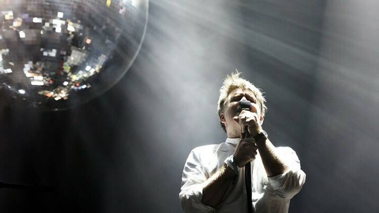 LCD Soundsystem performing live, with James Murphy and a disco ball