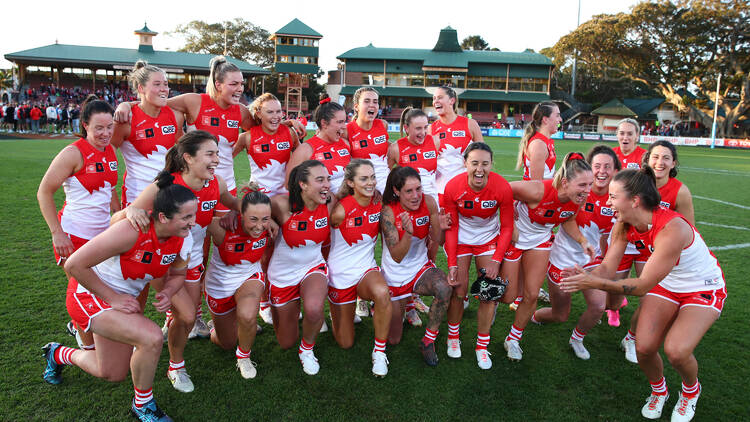 Swans players celebrate victory following the round one AFLW match between Sydney Swans and Greater Western Sydney Giants at North Sydney Oval on September 03, 2023 in Sydney, Australia. (Photo by Jason McCawley/Getty Images via AFL Photos)