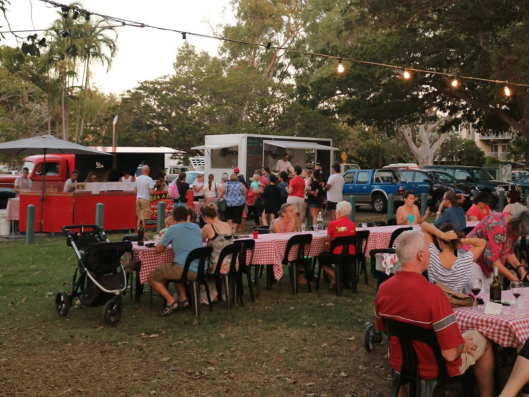 People dining at pizzeria outdoors