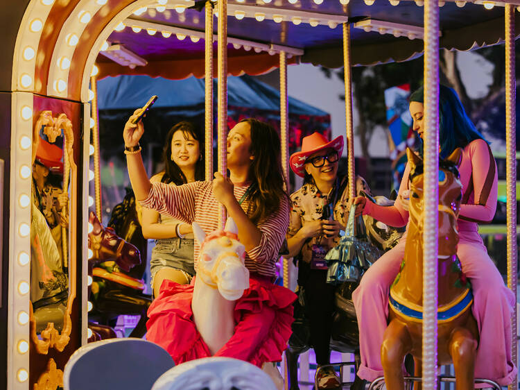 Festival-goers on the carousel at this year’s Highlight Act, Wonder World – The Machine of Nostalgia by Sam Lo “SKL0”  