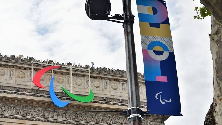 The Arc de Triomphe adorned with the Paralympics logo