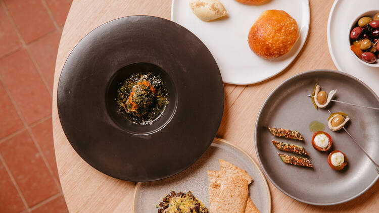 A table laden with plates of food.