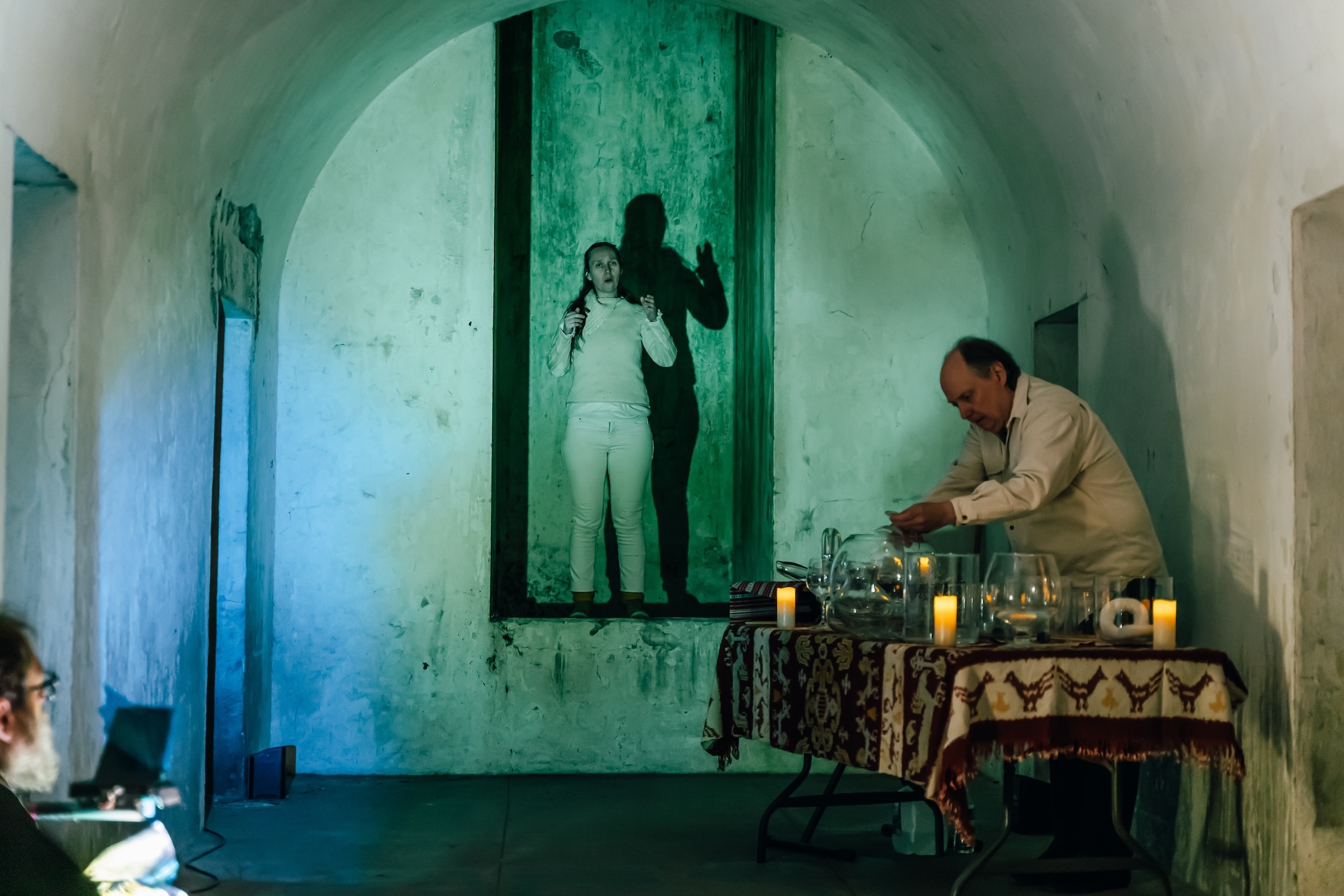 A person in the Catacombs at Green-Wood during a performance.