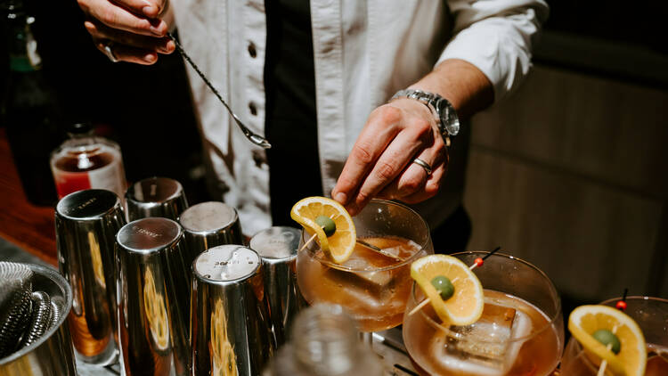 Bartender mixing cocktails.