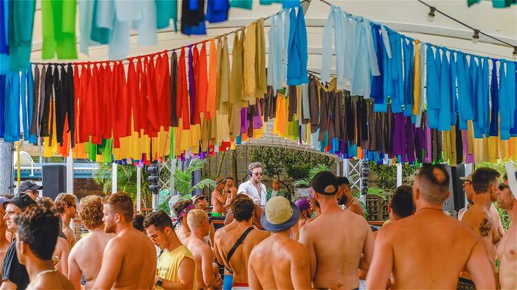 Pool party with rainbow flags