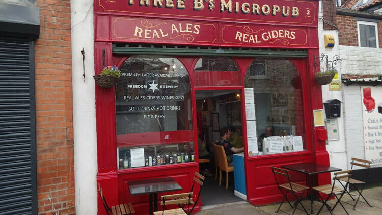 An image of a pub in Yorkshire with a red facade