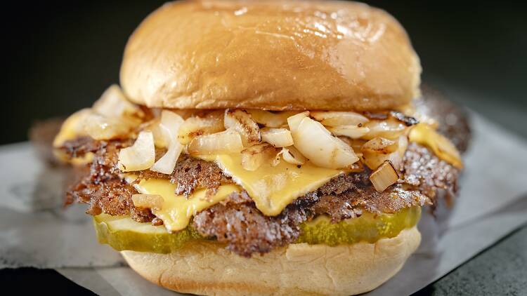 Double Classic burger with cheese, onions and a potato bun