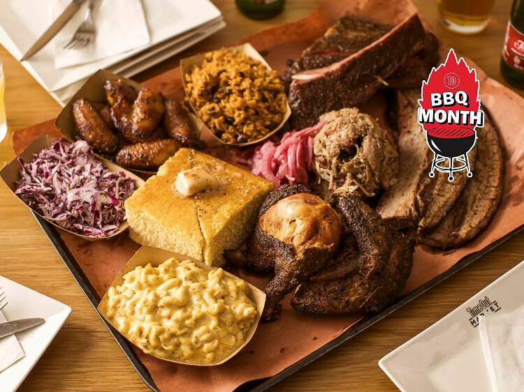 Plate of barbecue with briskey, pulled pork, cornbread, slaw and mac and cheese