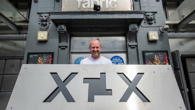 fabric co-founder Cameron Leslie holding a sign outside the club