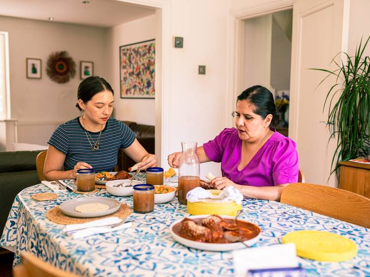 Karla Zazueta eating food at table