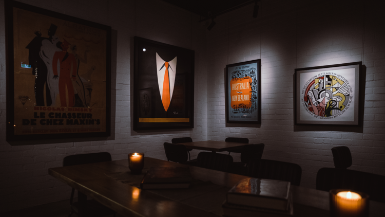 Dark bar with retro posters hanging up