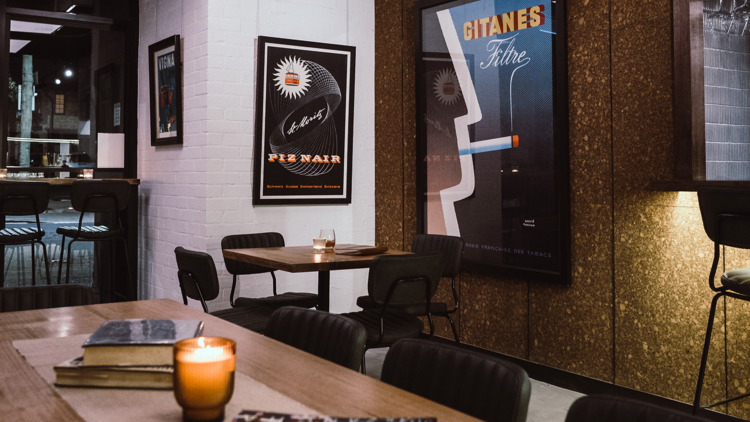 Dark bar with retro posters hanging up