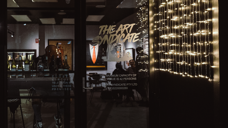 Dark bar with retro posters hanging up