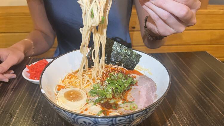 Bowl of ramen with egg, pork and seaweed