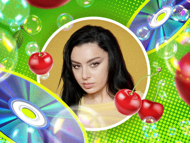 Charlie XCX surrounded by cherries, CDs and bubbles