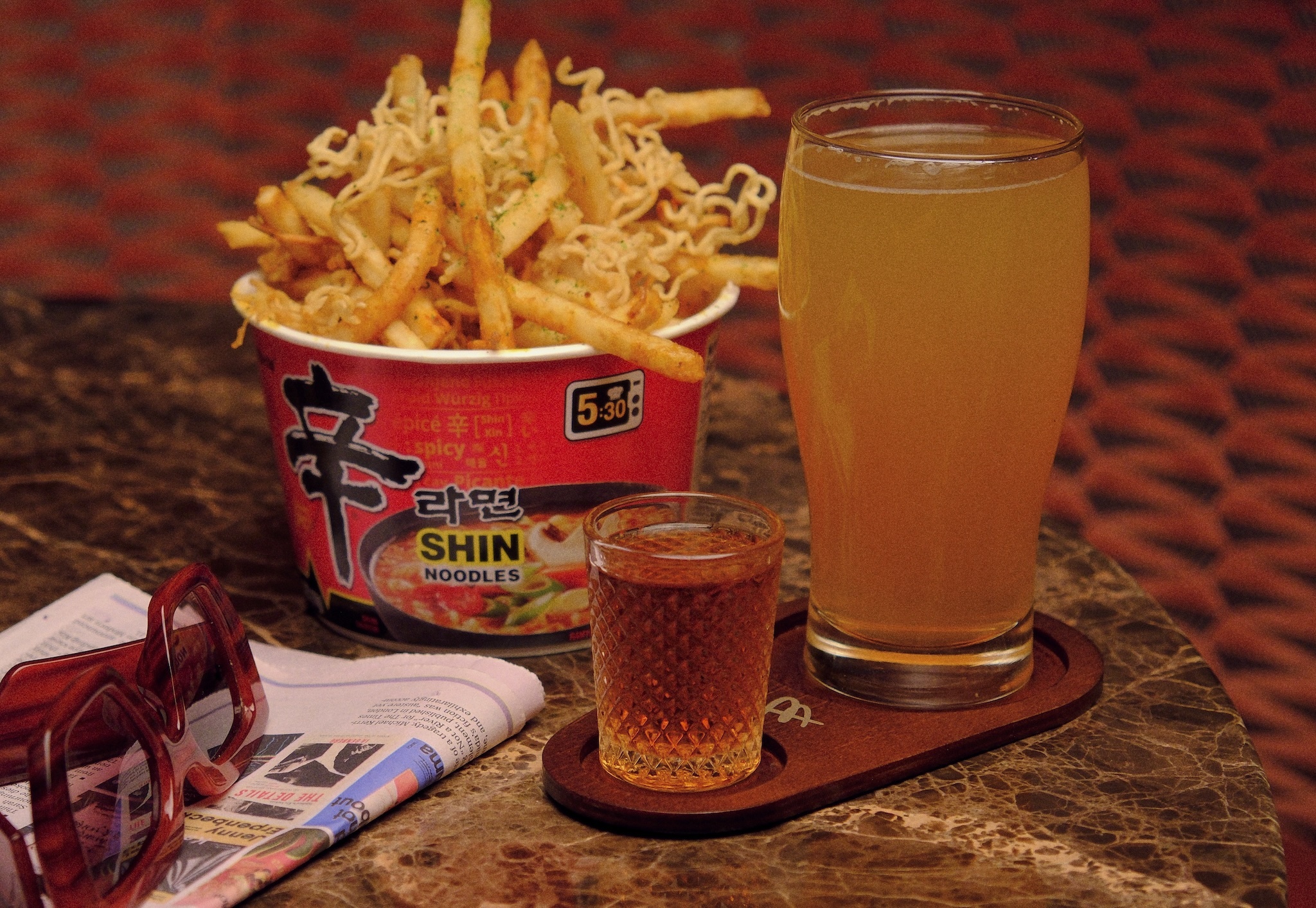 Disco Inferno Fries in a ramen dish and a beer and a shot