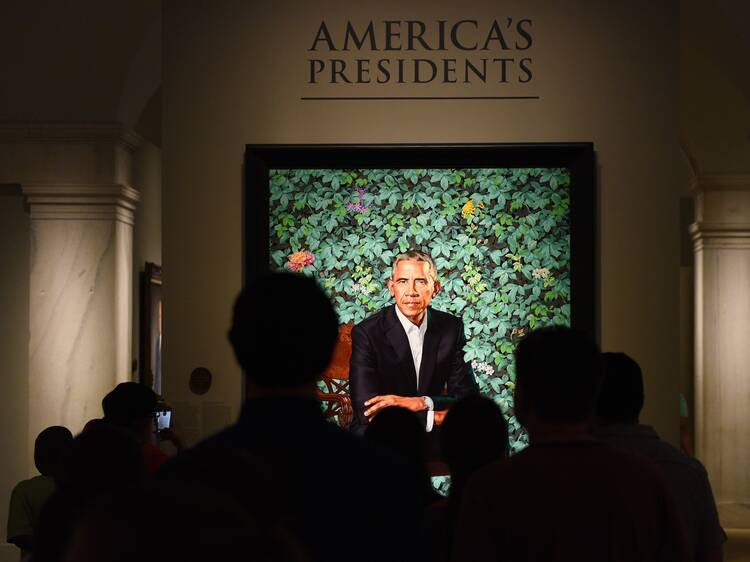 People look at a portrait of President Barack Obama at the National Portrait Gallery. 