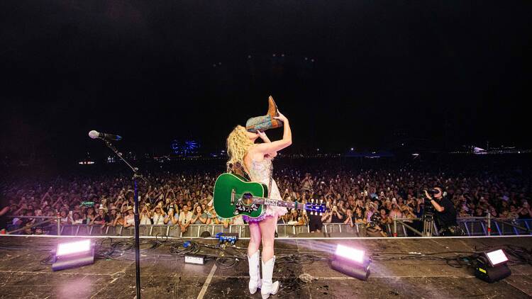 Country singer doing shoey on stage