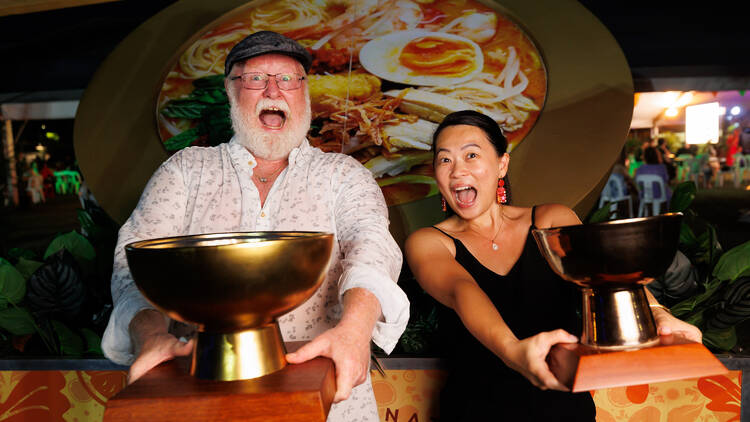 Winners holding trophies at laksa festival