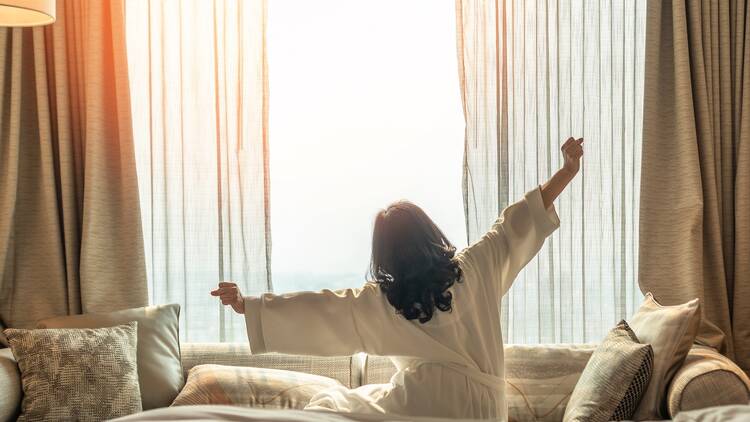 Woman in hotel room