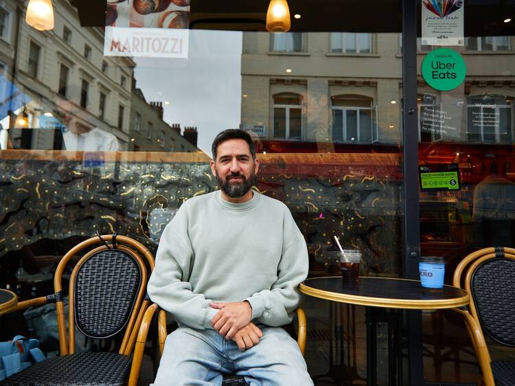 A man sitting outside coffee shop