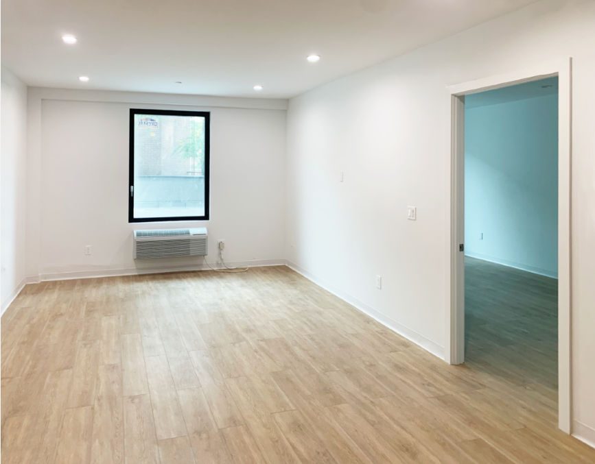 Astoria affordable housing apartment building living room