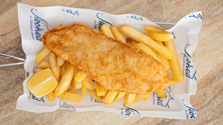 Fish and chips in takeaway box