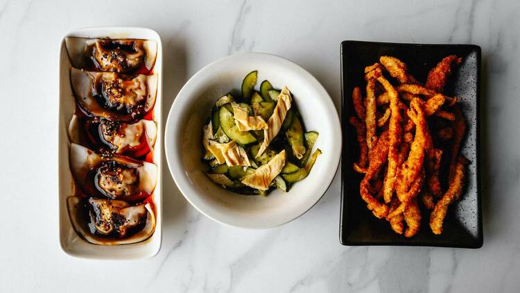 The chili oil pork dumplings, cucumber and bean curd salad, and mushroom fries at Mala Class.